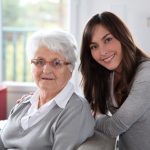 an older woman with her caregiver