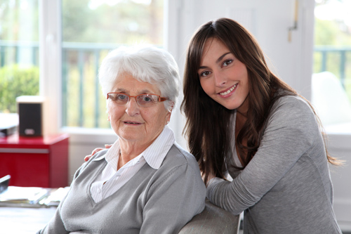 An older woman with her caregiver